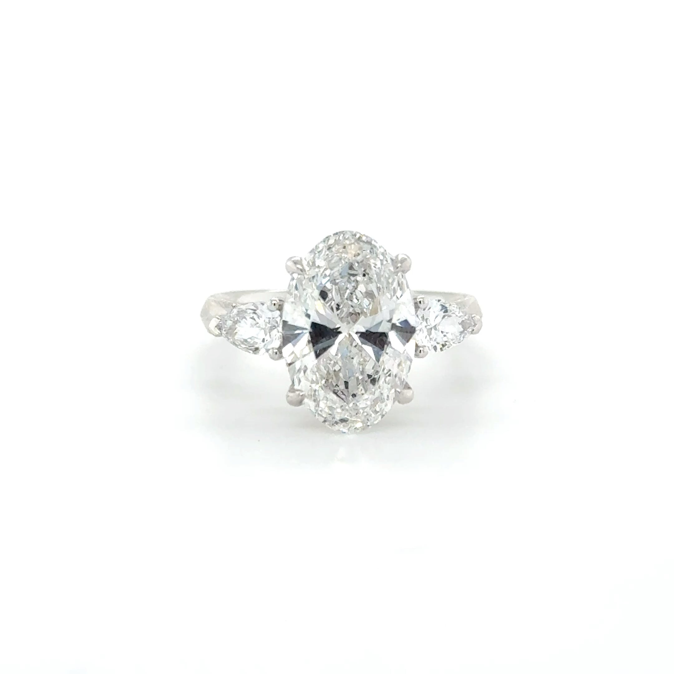 Celestine – 4.50ct Oval Engagement Ring with Pear-Shaped Side Stones | Trilogy Design